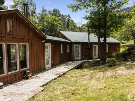 An image featuring plant, window, sky, building, tree, wood, house, land lot, architecture, cottage at 154 Fox Run Rd.