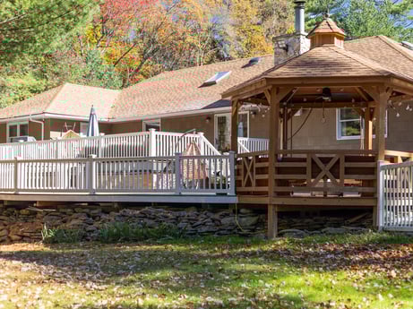 An image featuring plant, building, window, wood, botany, tree, porch, architecture, shade, house at 125 Rimstone Ct.