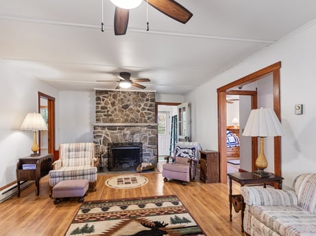 An image featuring furniture, picture frame, property, wood, table, lighting, interior design, couch, ceiling fan, comfort at 103 Mokoma Ave.