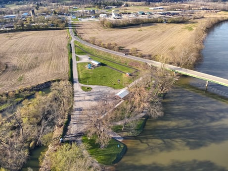 An image featuring water, plant, natural landscape, watercourse, fluvial landforms of streams, coastal and oceanic landforms, thoroughfare, landscape, slope, geological phenomenon at River Access Rd.