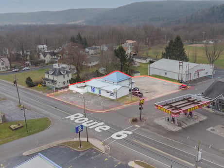 An image featuring building, sky, asphalt, tree, transport hub, land lot, urban design, road surface, road, plant at 199 State St.