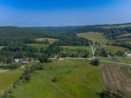 An image featuring sky, natural landscape, plant, tree, terrain, plain, slope, grassland, grass, meadow at 17899 US-6.