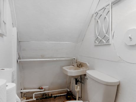 An image featuring property, tap, plumbing fixture, bathroom sink, sink, bathroom, toilet seat, toilet, interior design, floor at 302 N Keystone Ave.