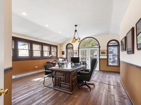 An image featuring picture frame, furniture, wood, table, hall, flooring, interior design, floor, living room, laminate flooring at 213 Main St.
