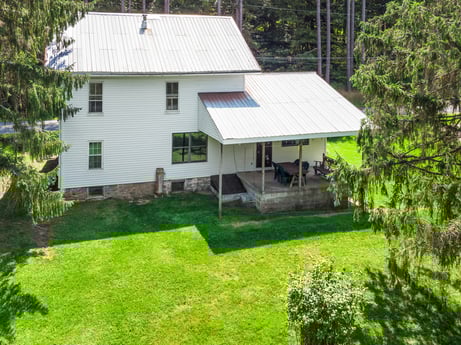 An image featuring plant, building, window, tree, land lot, house, cottage, residential area, grass, landscape at 1039 Old Bernice Rd.