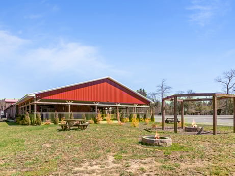 An image featuring sky, plant, cloud, building, shade, tree, land lot, grass, house, leisure at 4741 US-220.