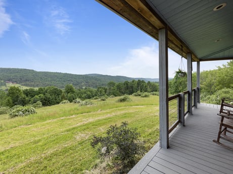 An image featuring sky, plant, cloud, tree, wood, porch, natural landscape, shade, cottage, grass at 1761 Brick House Rd.