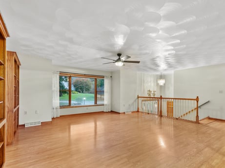 An image featuring wood, building, lighting, hall, interior design, floor, flooring, ceiling fan, laminate flooring, wood stain at 74 Susquehannock Trail.