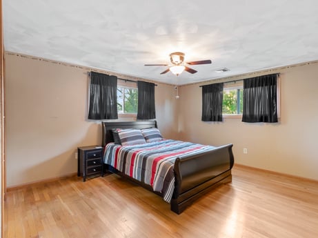 An image featuring furniture, property, building, comfort, wood, window, interior design, lighting, bed frame, ceiling fan at 491 Hillcrest Dr.