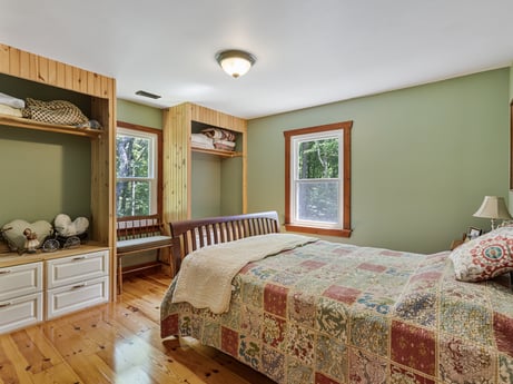 An image featuring furniture, property, wood, comfort, fixture, interior design, window, flooring, floor, cabinetry at 145 Nichols Ln.