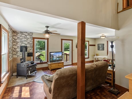 An image featuring picture frame, furniture, building, couch, wood, houseplant, table, window, interior design, plant at 145 Nichols Ln.