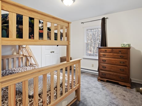 An image featuring furniture, property, cabinetry, wood, drawer, interior design, window, house, flooring, wood stain at 1061 Muncy St.