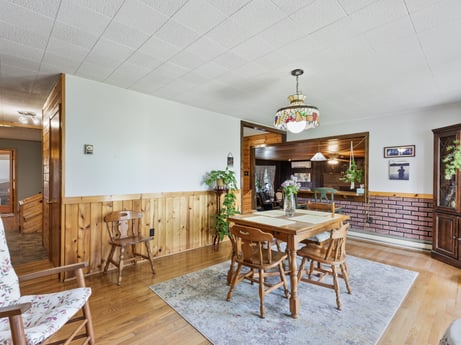 An image featuring furniture, table, property, chair, wood, interior design, living room, floor, flooring, cottage at 1195 Twin Cuts Rd.