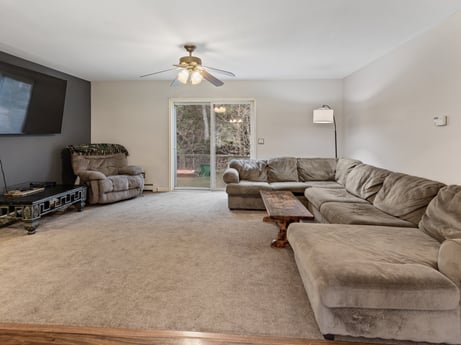 An image featuring couch, picture frame, property, furniture, table, wood, ceiling fan, lighting, interior design, floor at 1841 Lynch Rd.