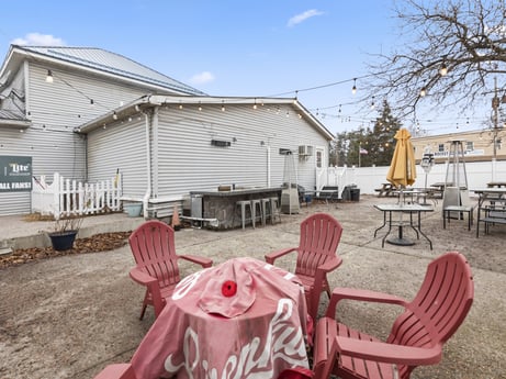 An image featuring sky, property, cloud, building, land lot, architecture, window, chair, neighbourhood, shade at 199 State St.