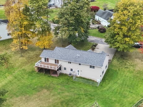 An image featuring plant, building, window, tree, house, land lot, residential area, landscape, urban design, real estate at 74 Susquehannock Trail.