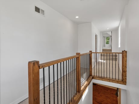An image featuring window, fixture, wood, paint, wood stain, stairs, flooring, floor, hardwood, baluster at 5442 Clarkstown Rd.