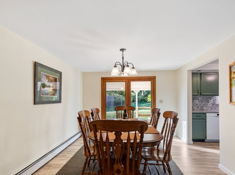 An image featuring picture frame, furniture, table, chair, wood, interior design, flooring, floor, kitchen & dining room table, hardwood at 62 Leons Rd.
