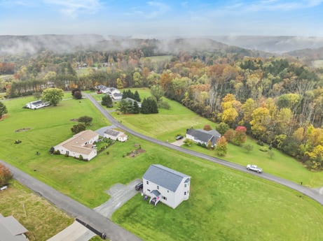 An image featuring cloud, plant, sky, property, ecoregion, nature, natural environment, natural landscape, land lot, tree at Country View Dr.