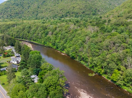 An image featuring water, plant, natural landscape, fluvial landforms of streams, vegetation, tree, watercourse, bank, riparian zone, landscape at 9224 PA-87.