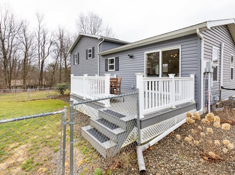 An image featuring window, plant, sky, building, tree, house, wood, land lot, landscape, cottage at 18 Country View Dr.