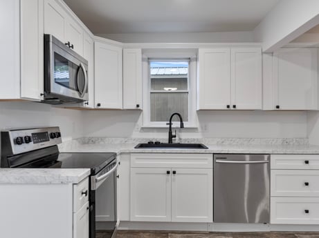 A kitchen at 127 Shore Dr featuring: cabinetry, countertop, property, kitchen sink, building, sink, white, kitchen stove, kitchen appliance, kitchen