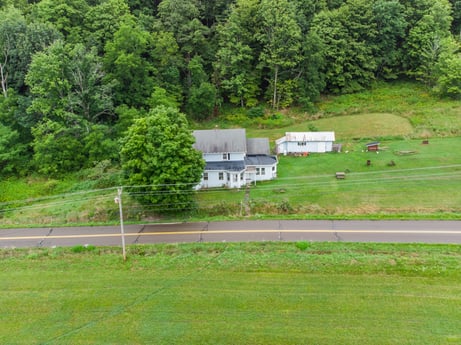 An image featuring plant, natural landscape, building, tree, land lot, highland, house, landscape, grassland, grass at 2399 Keene Summit Rd.