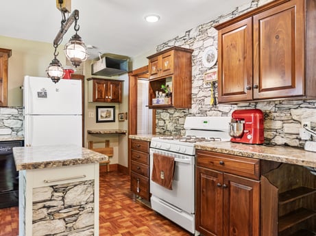 A kitchen at 145 Nichols Ln featuring: brown, cabinetry, countertop, property, furniture, kitchen appliance, kitchen, kitchen stove, wood, home appliance
