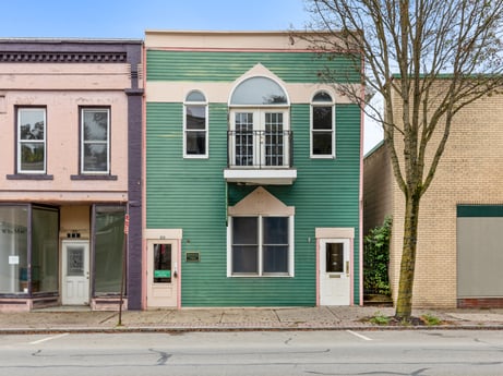 An image featuring window, building, sky, fixture, door, tree, wood, brick, residential area, siding at 213 Main St.