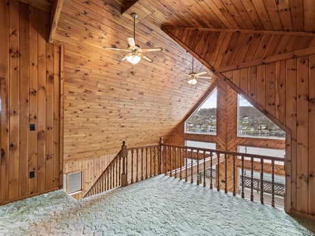 An image featuring wood, building, architecture, beam, wood stain, floor, fence, hardwood, window, ceiling at 815 Lakeside Dr.