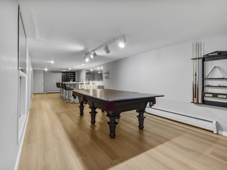 An image featuring table, building, lighting, wood, interior design, billiard table, recreation room, hall, flooring, house at 104 Stony Mountain Rd.