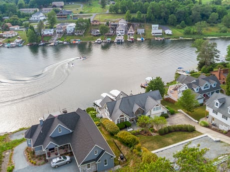 An image featuring water, building, water resources, property, plant, nature, tree, house, architecture, lake at 218 Point Rd.