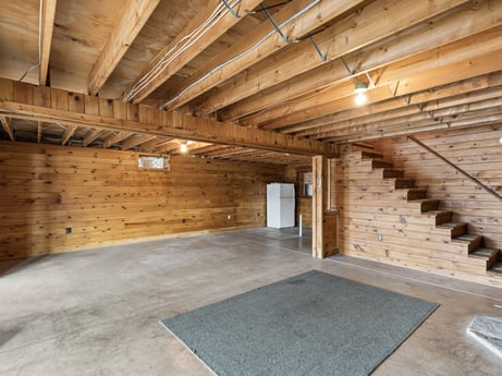 An image featuring wood, flooring, floor, hardwood, wood stain, beam, ceiling, building material, house, composite material at 815 Lakeside Dr.