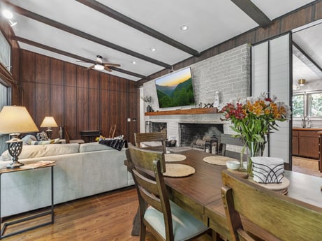 An image featuring table, property, flower, furniture, plant, chair, building, wood, houseplant, interior design at 104 Stony Mountain Rd.