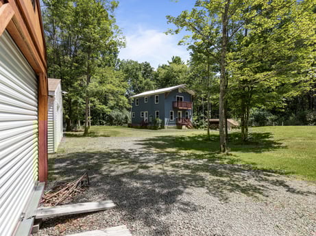 An image featuring plant, building, cloud, sky, tree, shade, land lot, house, cottage, road surface at 145 Nichols Ln.
