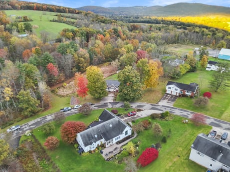 An image featuring plant, sky, land lot, natural landscape, cloud, urban design, biome, tree, grass, residential area at 74 Susquehannock Trail.