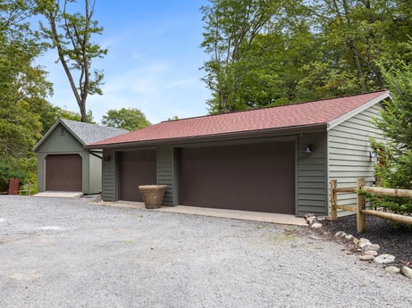 An image featuring plant, building, tree, sky, land lot, shade, road surface, asphalt, cottage, wood at 276 Mountain View Ln.