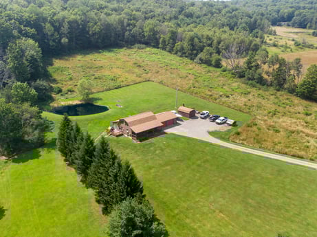 An image featuring plant, ecoregion, natural environment, tree, natural landscape, land lot, highland, grass, grassland, slope at 6583 N Rome Rd.