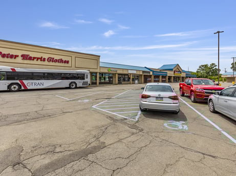 An image featuring wheel, automotive parking light, sky, tire, land vehicle, cloud, car, vehicle, bus, motor vehicle at 1040 Center St.