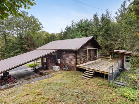 An image featuring plant, sky, building, wood, natural landscape, tree, land lot, cloud, cottage, leisure at 125 Marcy Rd.