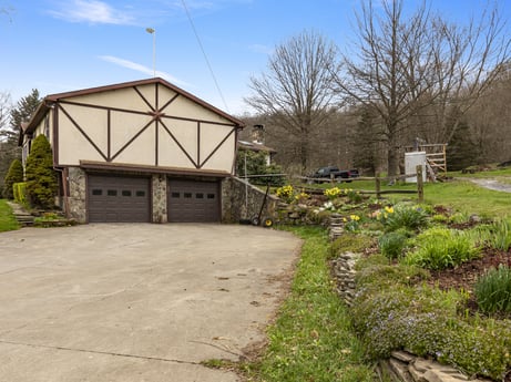 An image featuring plant, sky, cloud, building, tree, land lot, road, landscape, cottage, residential area at 1569 S Macafee Rd.