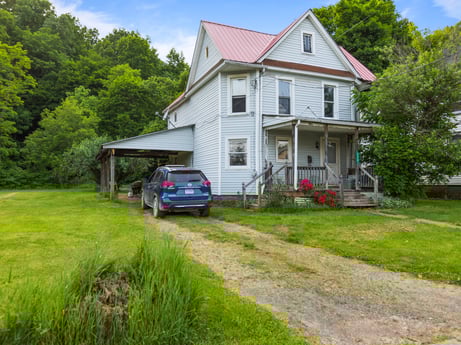 An image featuring plant, sky, building, property, window, car, vehicle, tire, tree, house at 138 T-329.