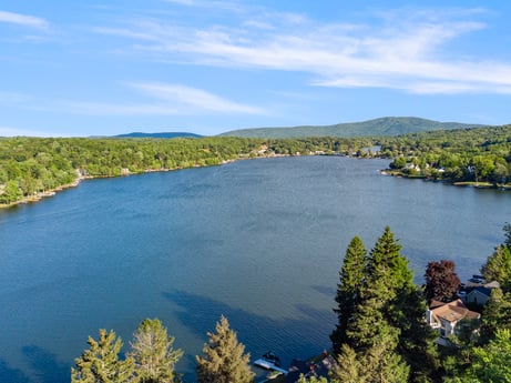 An image featuring water, cloud, sky, plant, natural landscape, tree, lake, coastal and oceanic landforms, mountain, lacustrine plain at 127 Shore Dr.