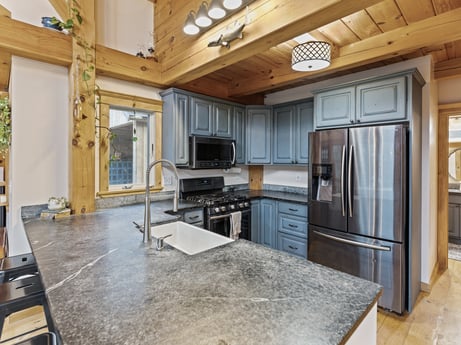 A kitchen at 144 Milton Ln featuring: property, cabinetry, countertop, kitchen, wood, interior design, architecture, kitchen stove, kitchen appliance, home appliance