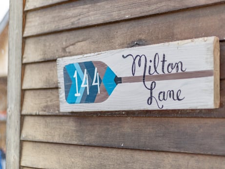 An image featuring wood, font, building, gas, handwriting, rectangle, motor vehicle, signage, brick, house at 144 Milton Ln.
