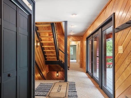 An image featuring door, building, fixture, picture frame, hall, wood, interior design, flooring, floor, house at 276 Mountain View Ln.