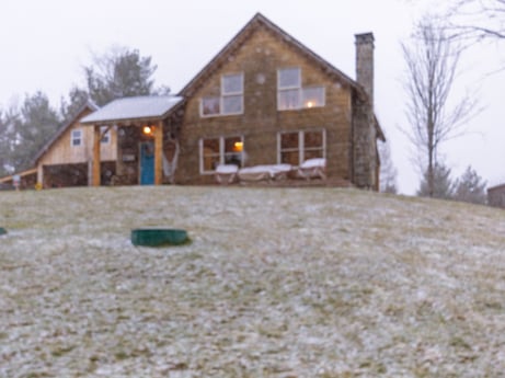 An image featuring sky, building, property, window, plant, tree, house, land lot, grass, siding at 144 Milton Ln.