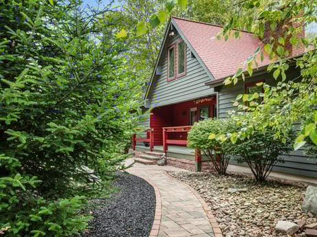 An image featuring plant, building, wood, house, tree, natural landscape, cottage, grass, woody plant, real estate at 276 Mountain View Ln.