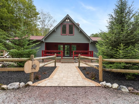An image featuring plant, sky, building, cloud, tree, wood, botany, house, window, cottage at 276 Mountain View Ln.