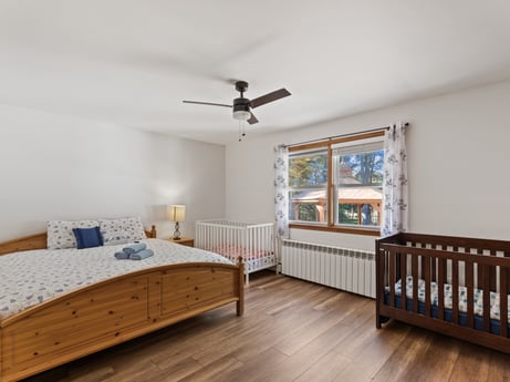An image featuring furniture, window, ceiling fan, cabinetry, window blind, wood, interior design, flooring, floor, wood stain at 125 Rimstone Ct.